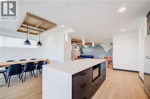 Spacious open-concept area featuring wood-finish flooring throughout - 1333 Weber Street E Unit# 708, Kitchener, ON - Indoor