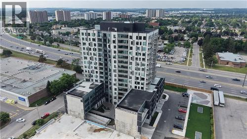 Contemporary high-rise building featuring a multi-story base with structured parking - 1333 Weber Street E Unit# 708, Kitchener, ON - Outdoor With View
