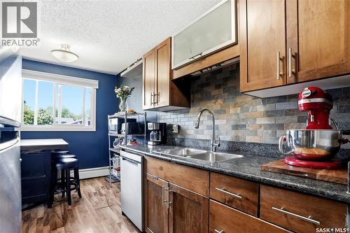 7 115 Acadia Drive, Saskatoon, SK - Indoor Photo Showing Kitchen With Double Sink