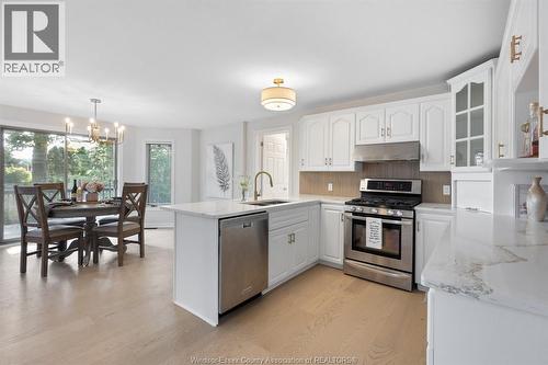 144 Pheasant Run, Lakeshore, ON - Indoor Photo Showing Kitchen With Double Sink
