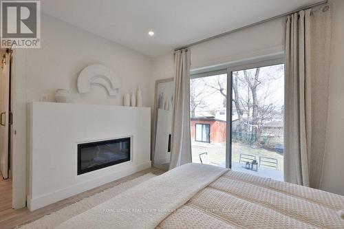 75 Rangoon Road, Toronto, ON - Indoor Photo Showing Bedroom With Fireplace
