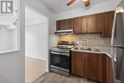 313 - 310 Kingsdale Avenue, Kingston (East Gardiners Rd), ON - Indoor Photo Showing Kitchen With Double Sink