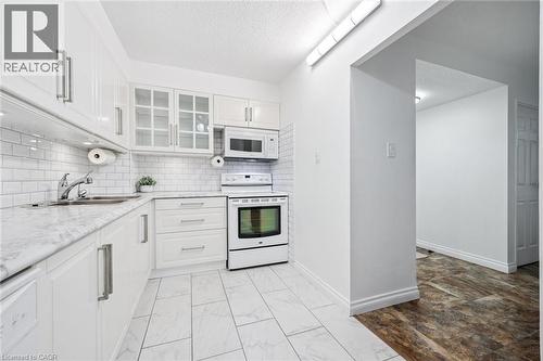 93 Westwood Road Unit# 607, Guelph, ON - Indoor Photo Showing Kitchen With Double Sink