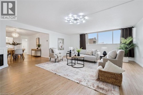 93 Westwood Road Unit# 607, Guelph, ON - Indoor Photo Showing Living Room With Fireplace