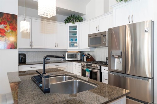 #402-3210 Jacklin Rd, Langford, BC - Indoor Photo Showing Kitchen With Double Sink