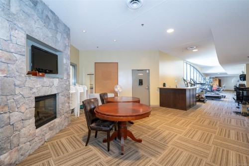#402-3210 Jacklin Rd, Langford, BC - Indoor Photo Showing Other Room With Fireplace