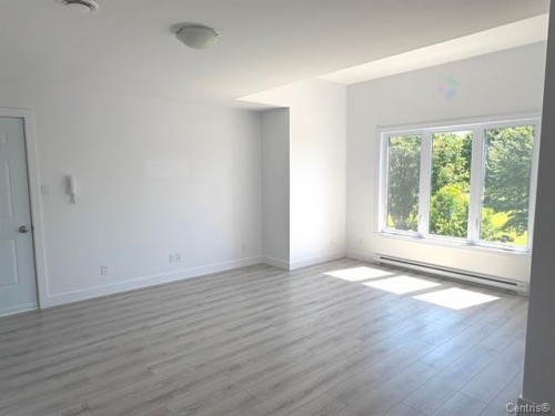Salon - 4-313 Av. Nault, Rouyn-Noranda, QC - Indoor Photo Showing Other Room