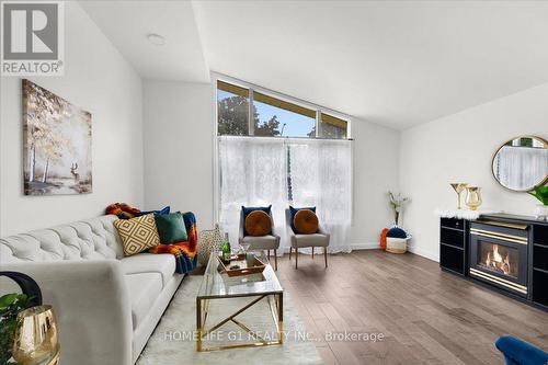 19 Milton Avenue W, Cambridge, ON - Indoor Photo Showing Living Room With Fireplace