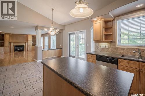 226 Horlick Crescent, Saskatoon, SK - Indoor Photo Showing Kitchen With Fireplace With Double Sink
