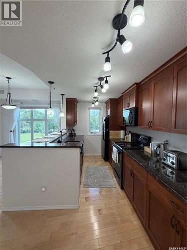 210 1220 Blackfoot Drive, Regina, SK - Indoor Photo Showing Kitchen