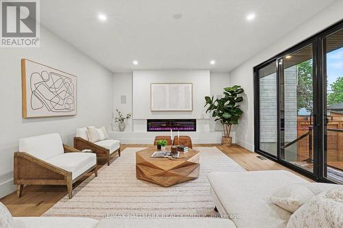 Floor to ceiling fireplace. - 218 Woodland Avenue, Ottawa, ON - Indoor Photo Showing Other Room