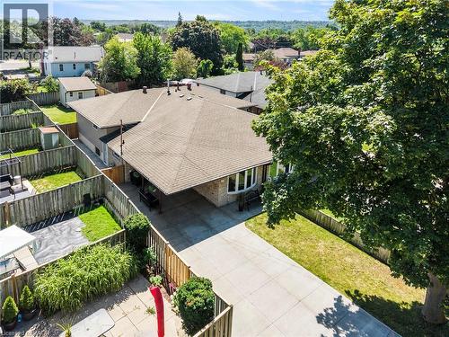 Overhead view showcasing a single-story residence with a brown shingle roof and light brick exterior - 167 Berkindale Drive, Hamilton, ON - Outdoor