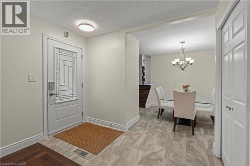 Entryway featuring a decorative glass-paneled door and a flush-mount ceiling light - 167 Berkindale Drive, Hamilton, ON - Indoor Photo Showing Other Room