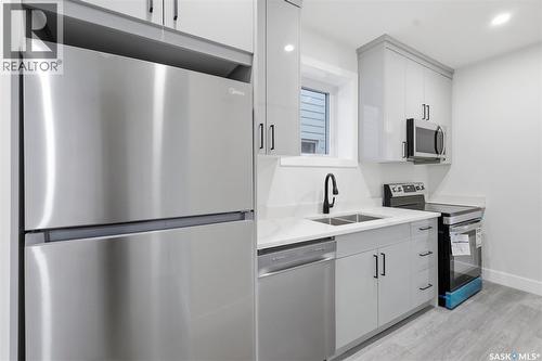 1215 Nightingale Terrace, Saskatoon, SK - Indoor Photo Showing Kitchen With Double Sink With Upgraded Kitchen