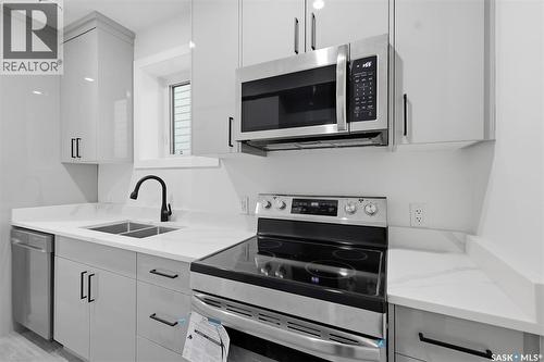 1215 Nightingale Terrace, Saskatoon, SK - Indoor Photo Showing Kitchen With Double Sink