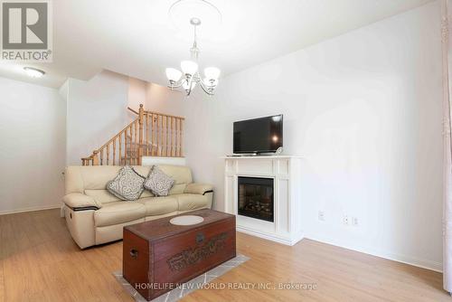 12 - 21 St. Moritz Way, Markham, ON - Indoor Photo Showing Living Room With Fireplace