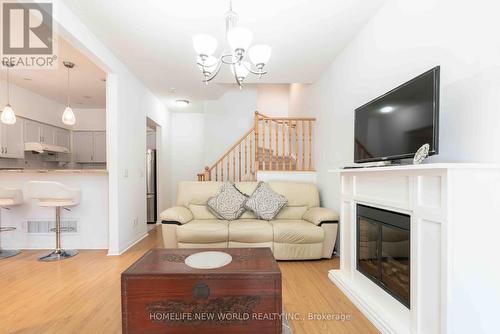 12 - 21 St. Moritz Way, Markham, ON - Indoor Photo Showing Living Room With Fireplace