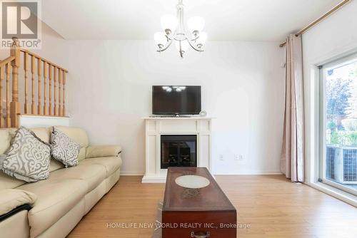 12 - 21 St. Moritz Way, Markham, ON - Indoor Photo Showing Living Room With Fireplace