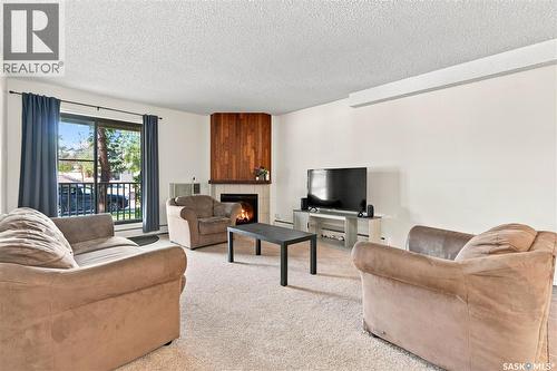 108G 1121 Mckercher Drive, Saskatoon, SK - Indoor Photo Showing Living Room With Fireplace