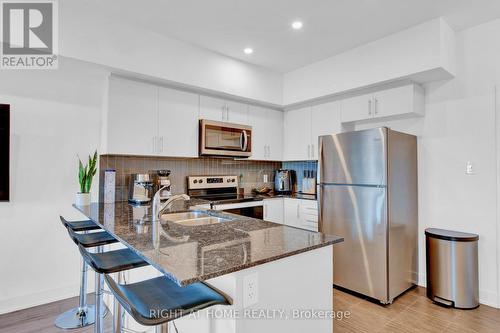 507 - 4 Spice Way, Barrie, ON - Indoor Photo Showing Kitchen With Stainless Steel Kitchen