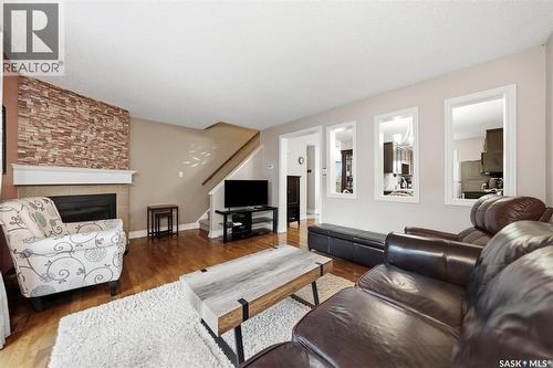 402 2703 Spadina Crescent E, Saskatoon, SK - Indoor Photo Showing Living Room With Fireplace