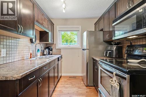 402 2703 Spadina Crescent E, Saskatoon, SK - Indoor Photo Showing Kitchen With Double Sink