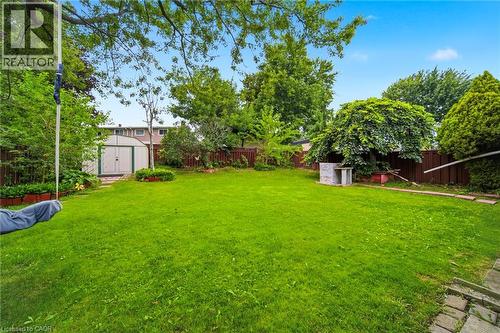 Expansive level lawn bordered by mature trees and established hedging, offering generous outdoor space - 6346 Neuchatel Road, Mississauga, ON - Outdoor
