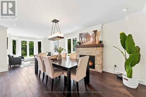 Stone Fireplace - 111 Whispering Pine Trail, Aurora, ON - Indoor Photo Showing Dining Room With Fireplace