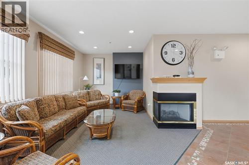 205 100 5Th Avenue, Regina Beach, SK - Indoor Photo Showing Living Room With Fireplace