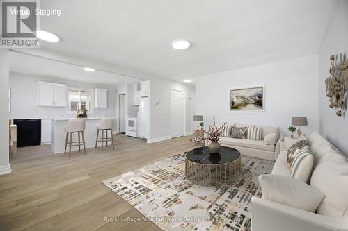 Virtually Staged - 680 Raglan Street, Minto (Palmerston), ON - Indoor Photo Showing Living Room