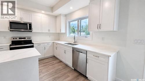 1220 D Avenue N, Saskatoon, SK - Indoor Photo Showing Kitchen With Double Sink