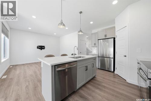 377 Germain Manor, Saskatoon, SK - Indoor Photo Showing Kitchen With Stainless Steel Kitchen With Double Sink With Upgraded Kitchen