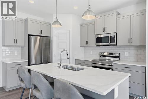377 Germain Manor, Saskatoon, SK - Indoor Photo Showing Kitchen With Stainless Steel Kitchen With Double Sink With Upgraded Kitchen