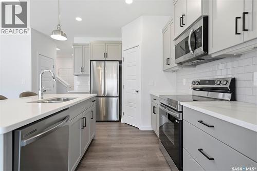 377 Germain Manor, Saskatoon, SK - Indoor Photo Showing Kitchen With Stainless Steel Kitchen With Double Sink With Upgraded Kitchen