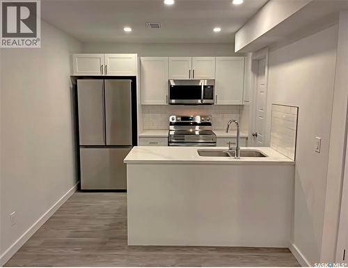 377 Germain Manor, Saskatoon, SK - Indoor Photo Showing Kitchen With Double Sink