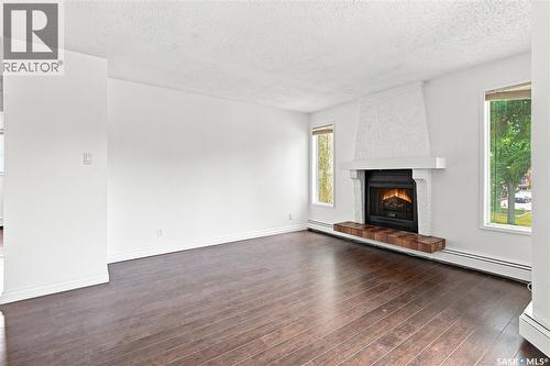 301 116 111Th Street, Saskatoon, SK - Indoor Photo Showing Living Room With Fireplace