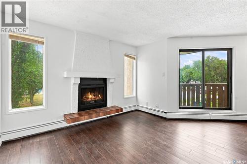 301 116 111Th Street, Saskatoon, SK - Indoor Photo Showing Living Room With Fireplace
