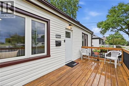 Exterior with white horizontal siding and dark trim accents - 450 East 42Nd Street, Hamilton, ON - Outdoor With Deck Patio Veranda With Exterior