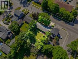 Aerial perspective showcasing a residential property with established landscaping - 