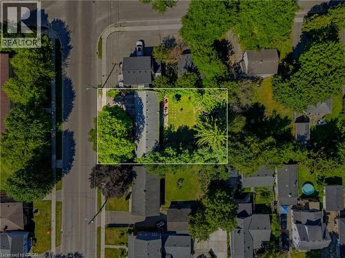 Aerial view of a substantial residential lot featuring mature landscaping with established trees throughout the property, manicured lawn areas, and defined hardscaping along the perimeter - 356 Thompson Road, London, ON - Outdoor With View