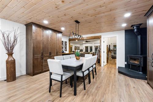 37 Mckay Loop, Alexander, MB - Indoor Photo Showing Dining Room With Fireplace