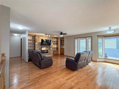 138 Lynx Crescent, Brandon, MB - Indoor Photo Showing Living Room With Fireplace