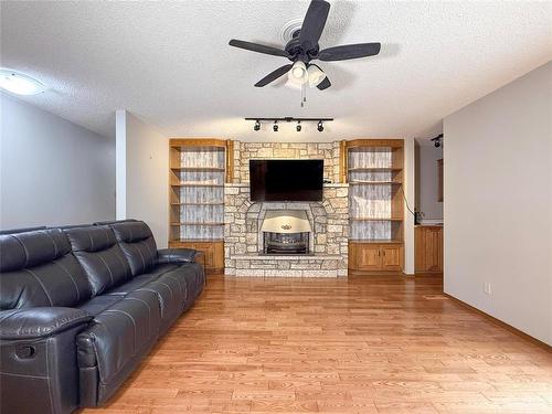 138 Lynx Crescent, Brandon, MB - Indoor Photo Showing Living Room With Fireplace