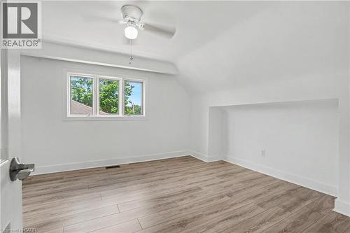 Room featuring light wood-finish flooring, white walls, and a multi-pane window - 100 Hardale Crescent, Hamilton, ON - Indoor Photo Showing Other Room