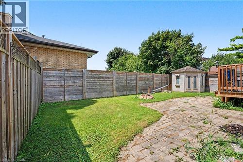 Expansive backyard featuring a combination of grass and paver stone patio - 100 Hardale Crescent, Hamilton, ON - Outdoor