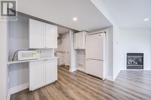 100 Lauris Avenue, Cambridge, ON - Indoor Photo Showing Kitchen With Fireplace