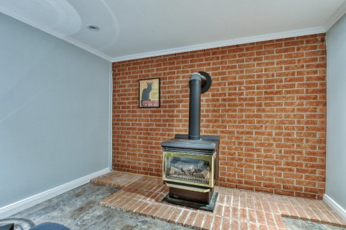 Salle familiale - 115 1Re Avenue, Saint-Eustache, QC - Indoor With Fireplace