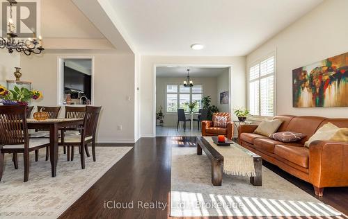 Living Room with Dark Rich Hardwood Floors - 954 Penson Crescent, Milton, ON - Indoor