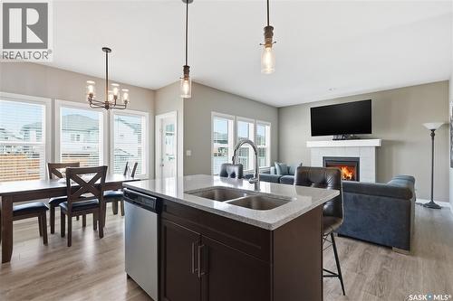 118 Stromberg Crescent, Saskatoon, SK - Indoor Photo Showing Other Room With Fireplace