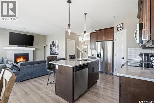 118 Stromberg Crescent, Saskatoon, SK - Indoor Photo Showing Kitchen With Fireplace With Upgraded Kitchen